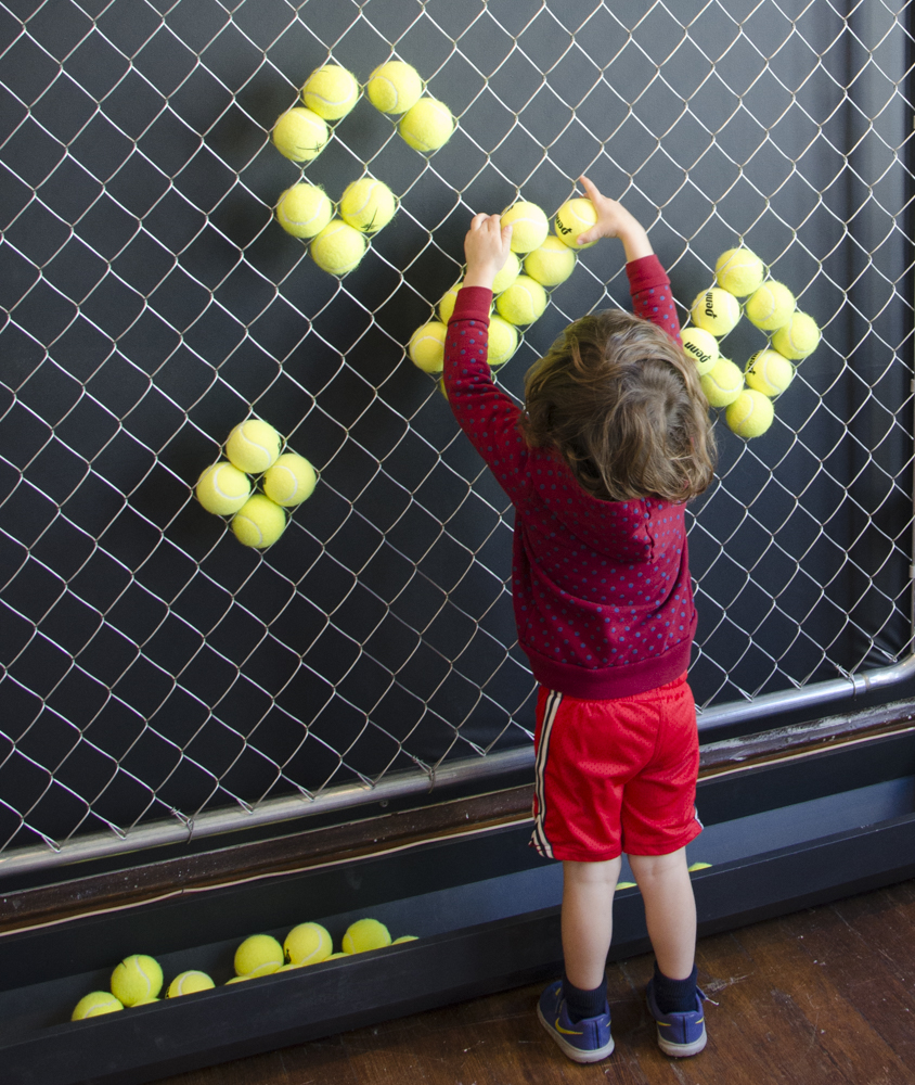 image of a child interacting with the living fence